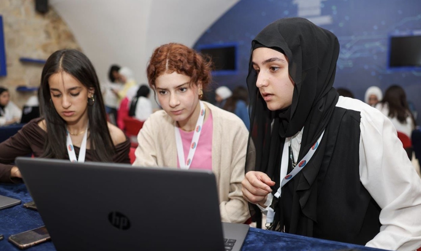 Young women exploring technology together